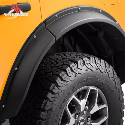Close-up of retro-inspired bolt accents integrated into Havoc EVOC Bronco fender flares