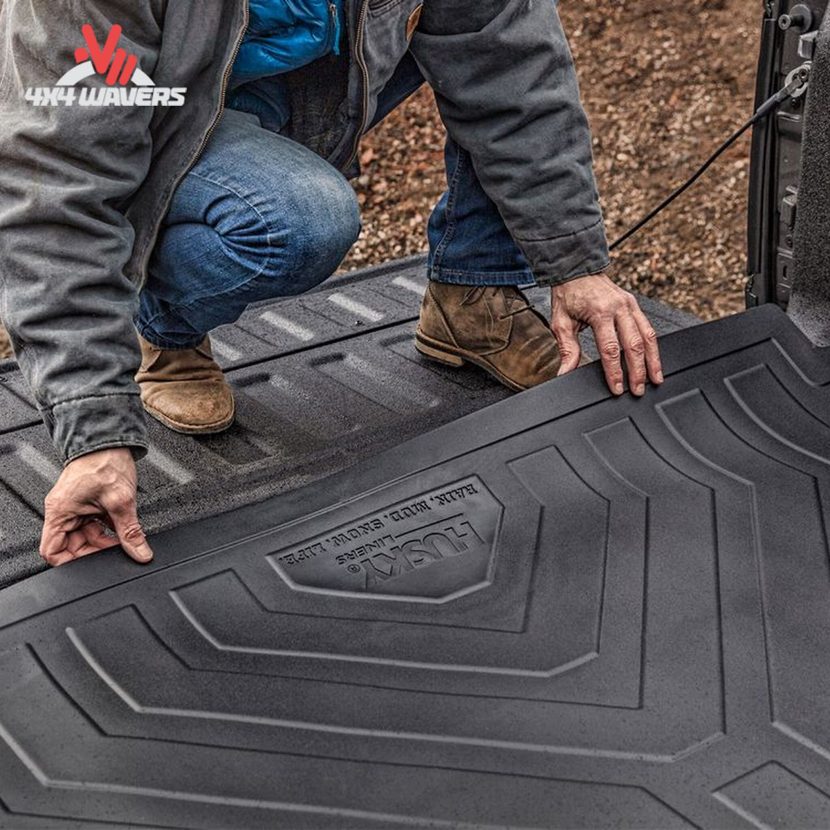 Husky Liners Heavy-Duty Rubber Bed Mat with anti-skid surface in a Ford F-150 5.5 ft bed, durable and textured for cargo protection.
