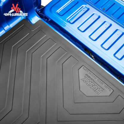 Husky Liners Heavy-Duty Rubber Bed Mat with anti-skid surface for 2015-2026 Ford F-150 5.5 ft bed, textured for durability.