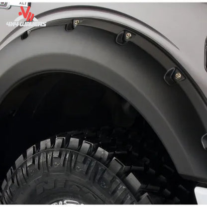Husky Pocket Style Fender Flares with rivet detail on a 2009-2014 Ford F-150 truck for enhanced style and protection.