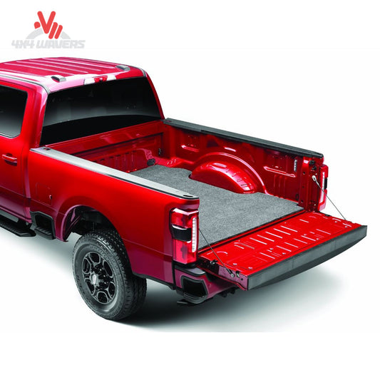 Full view of GMC Sierra short bed fitted with soft charcoal Husky bed liner mat SKU HBMC07CCS