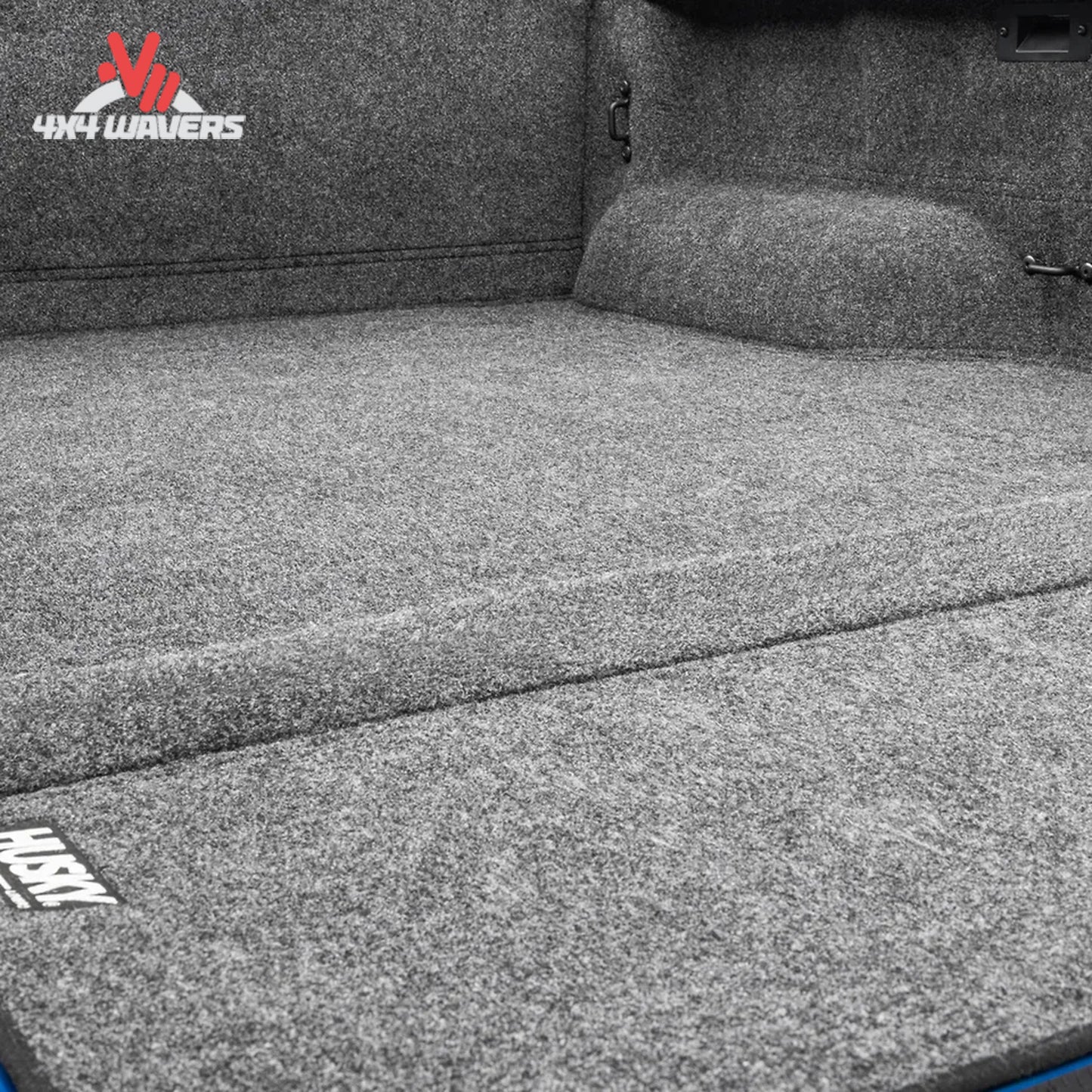 Husky Liners Guardian Comfort full bed liner for 2004-2014 Ford F-150 with textured surface in the truck bed.
