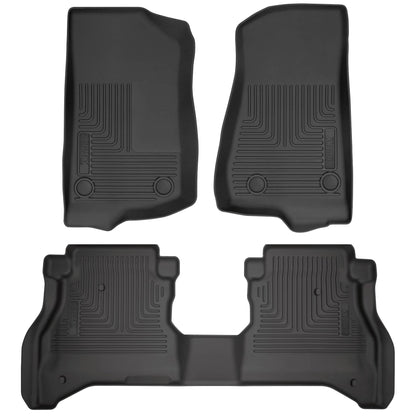 Husky Liners WeatherBeater black front and rear floor mats installed in a 2020-2025 Jeep Gladiator JT, protecting vehicle flooring.