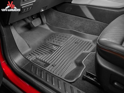 Husky WeatherBeater black floor liners for 2018-2025 Jeep Wrangler JL 4-door, front and rear all-weather floor mats.