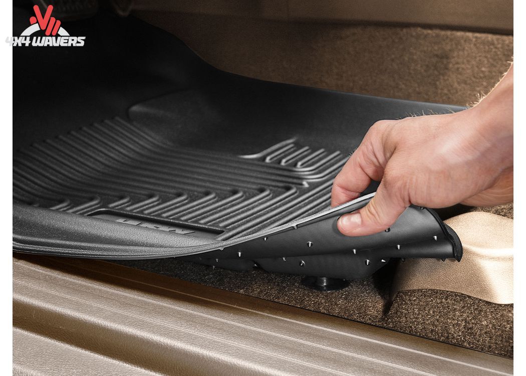 Close-up of black Husky WeatherBeater Floor Liners for 2018-2025 Jeep Wrangler JL 4-Door, showing textured TPO surface.