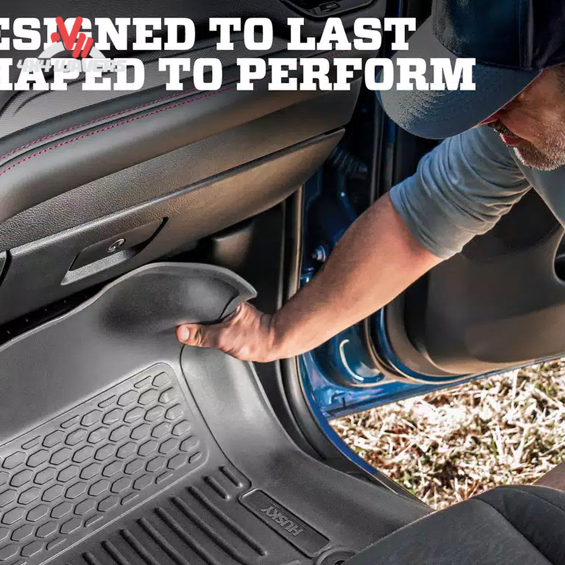 A person reaches down into a car footwell to demonstrate a black molded floor mat. The image includes bold white text at the top reading 'DESIGNED TO LAST' and 'MAPPED TO PERFORM'.