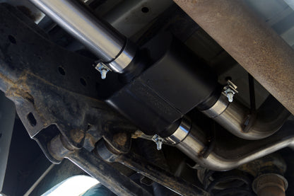 Flowmaster Outlaw Cat-back Exhaust System Kit installed on a vehicle, showcasing the stainless steel exhaust pipes and muffler.