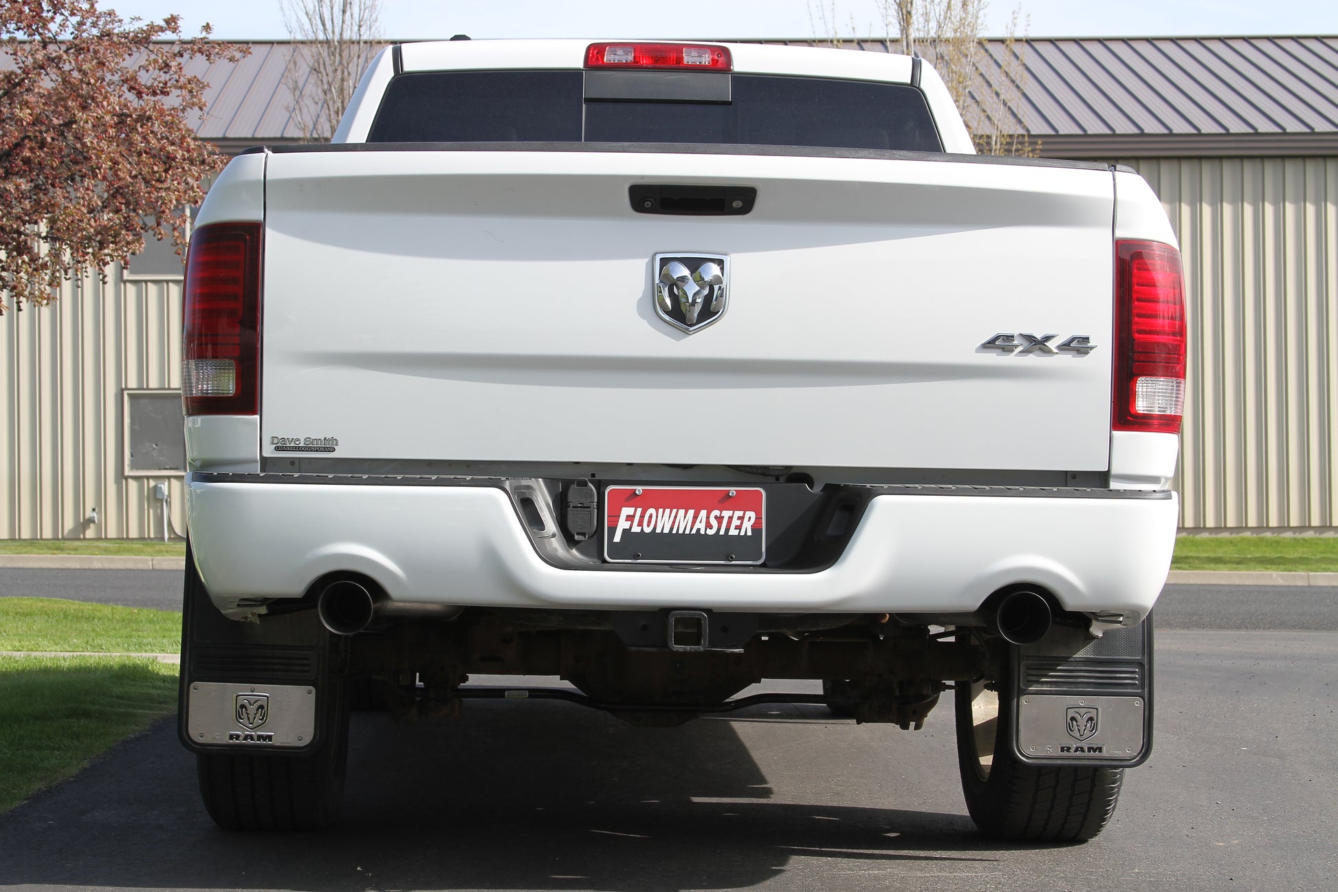 Flowmaster Outlaw Cat-back Exhaust System Kit showing chrome pipes and muffler components for high-performance vehicle upgrade.