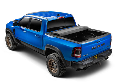 Extang Endure ALX hard folding tonneau cover folded open on a 2020-2026 Jeep Gladiator 5FT bed, showcasing durable truck bed protection.
