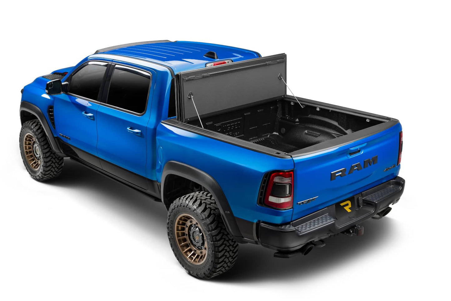 Extang Endure ALX hard folding tonneau cover on a 2020-2026 Jeep Gladiator with 5ft bed, shown folded open.