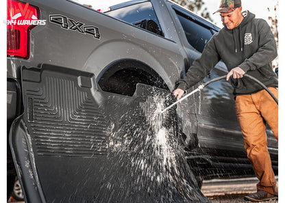 Black Husky WeatherBeater floor liners for 2018-2025 Jeep Wrangler JL 4-door, all-weather off-road protection.