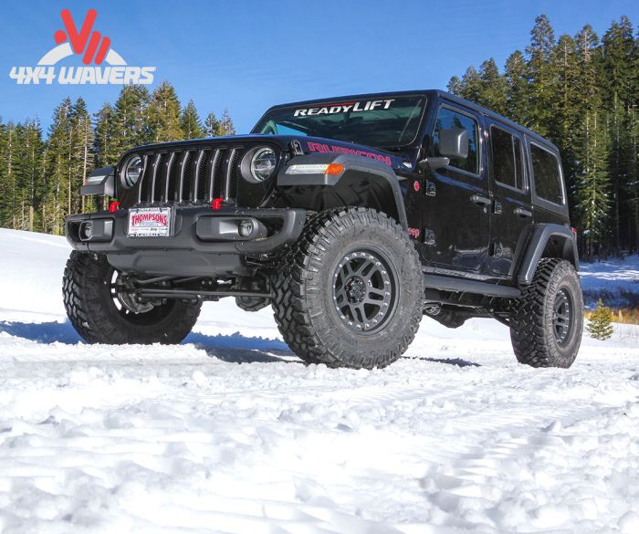 ReadyLIFT 2.5-inch SST lift kit installed on a 2018-2026 Jeep Wrangler JL Sahara and Sport, shown from a side view with lifted suspension.