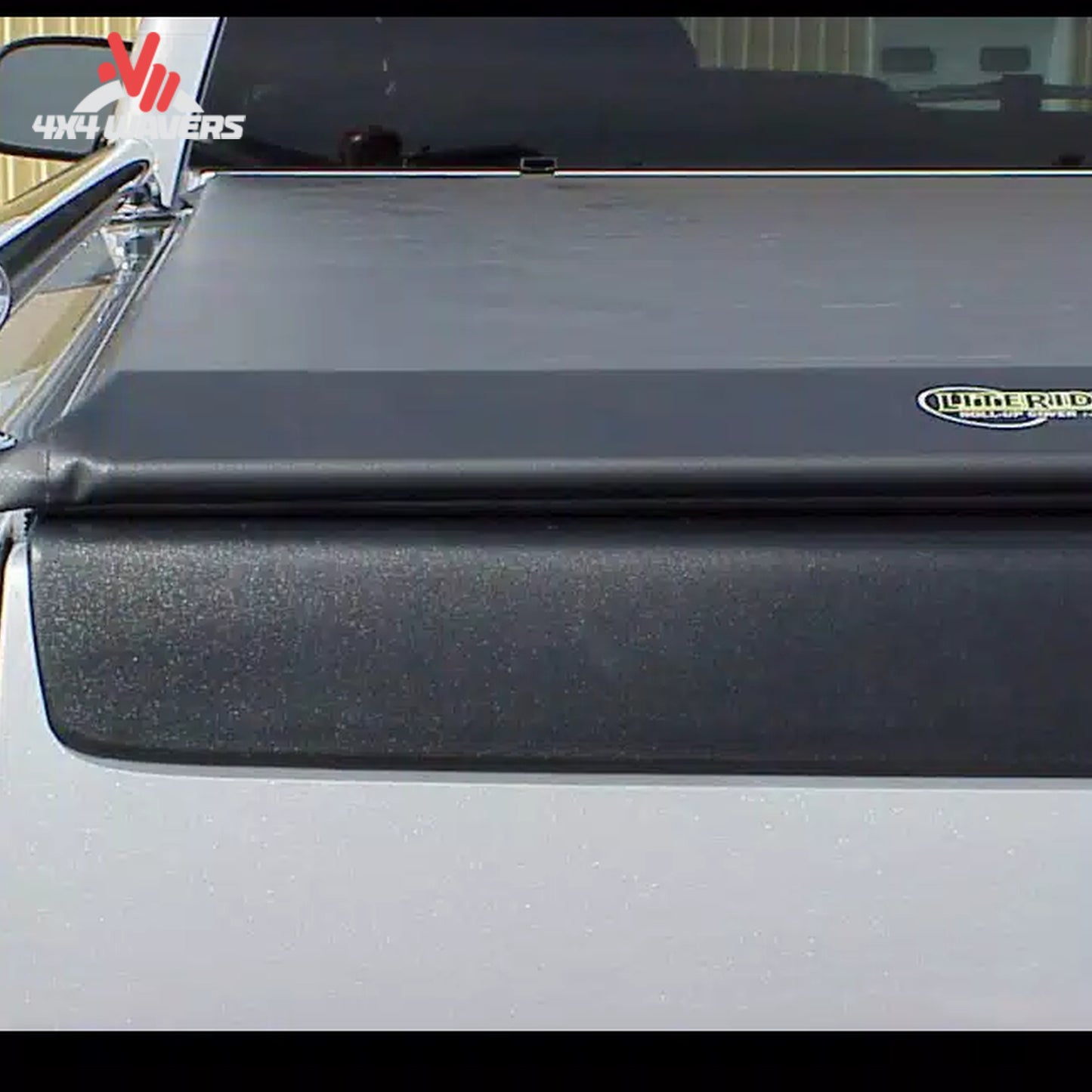 A durable black vinyl soft roll up truck bed cover installed on a 6.5 foot standard box Ford F-150 SKU BGPC_31379.