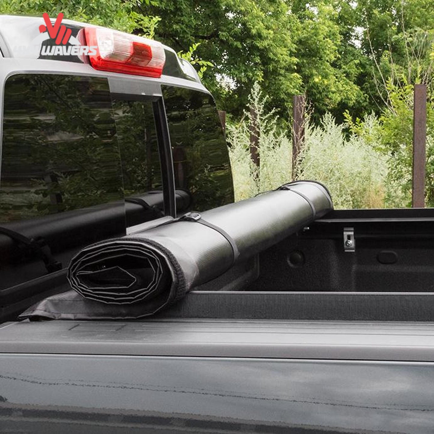 LITERIDER roll up bed cover 31379 rolled forward to cab with standard storage straps SKU BGPC_31379.