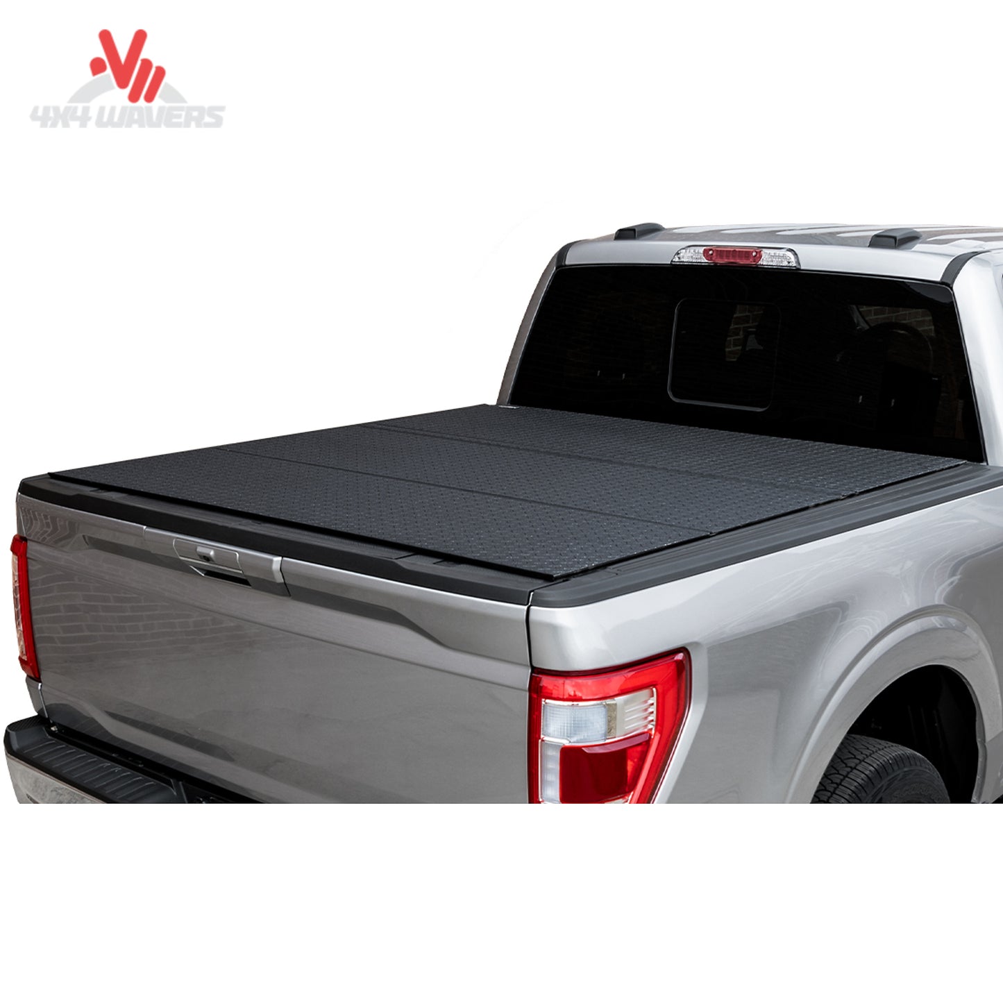 An ultra low profile tri fold hard truck bed cover mounted flush on a standard box silver Ford F-150.