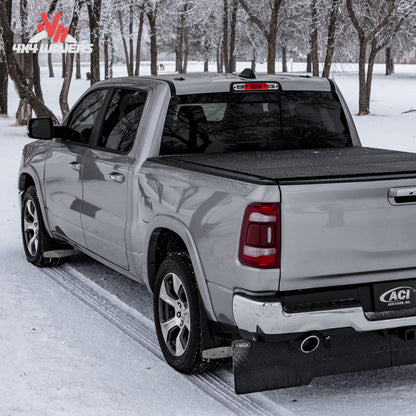 An ultra low profile tri fold hard truck bed cover mounted flush on a standard box silver Ford F-150.