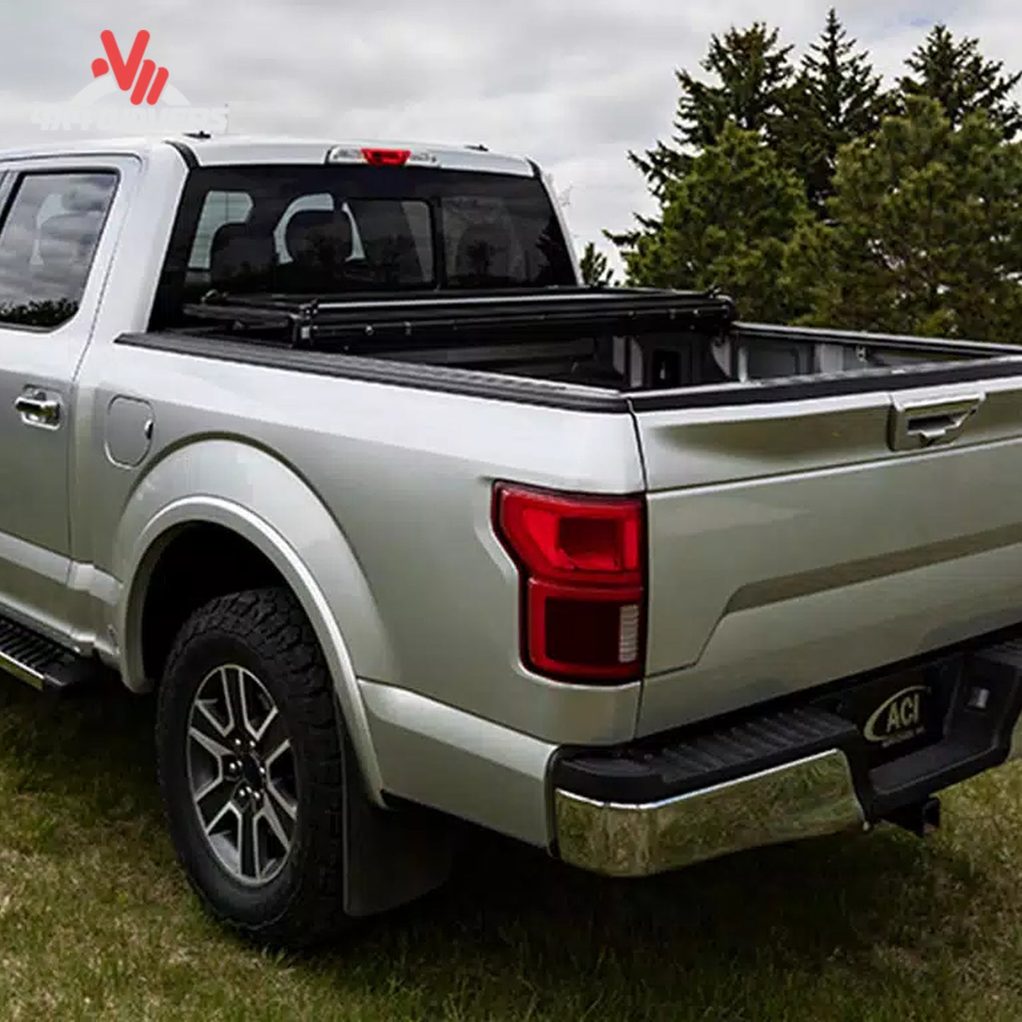An ultra low profile vertical folding hard truck bed cover mounted flush on a standard box silver Ford F-150.
