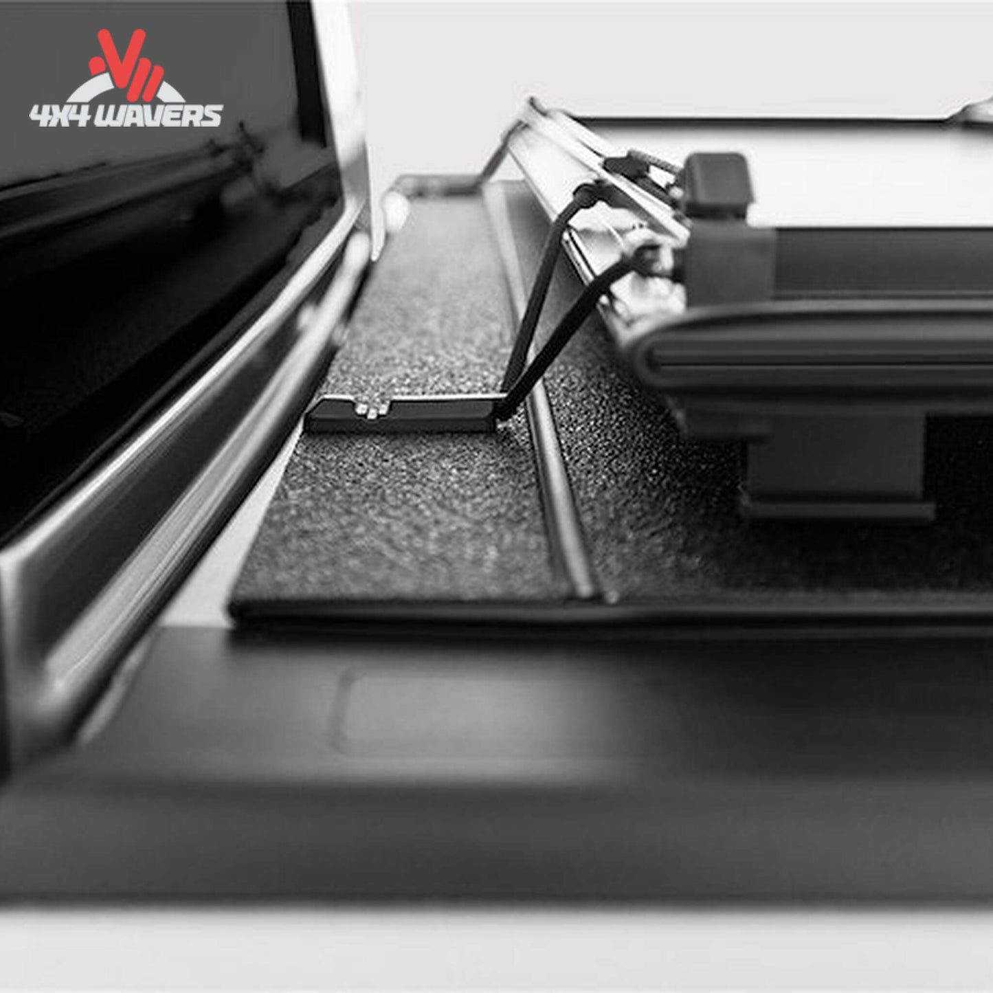 A black LOMAX Stance Tonneau Cover with tight bite clamp latch on a Ford F-150 5.5ft bed, installed on a pickup truck.