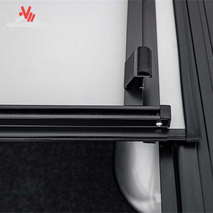 ACI LOMAX Stance Tonneau Cover with tight-bite clamp latch on a 04-26 Ford F-150 5.5ft bed, showcasing secure bed cover installation.