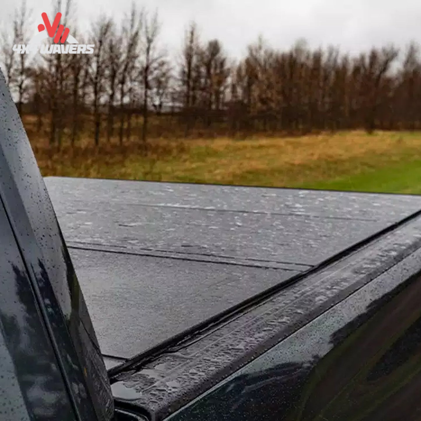 A close-up showing how the low profile aluminum tonneau cover seals tightly against the truck tailgate line.
