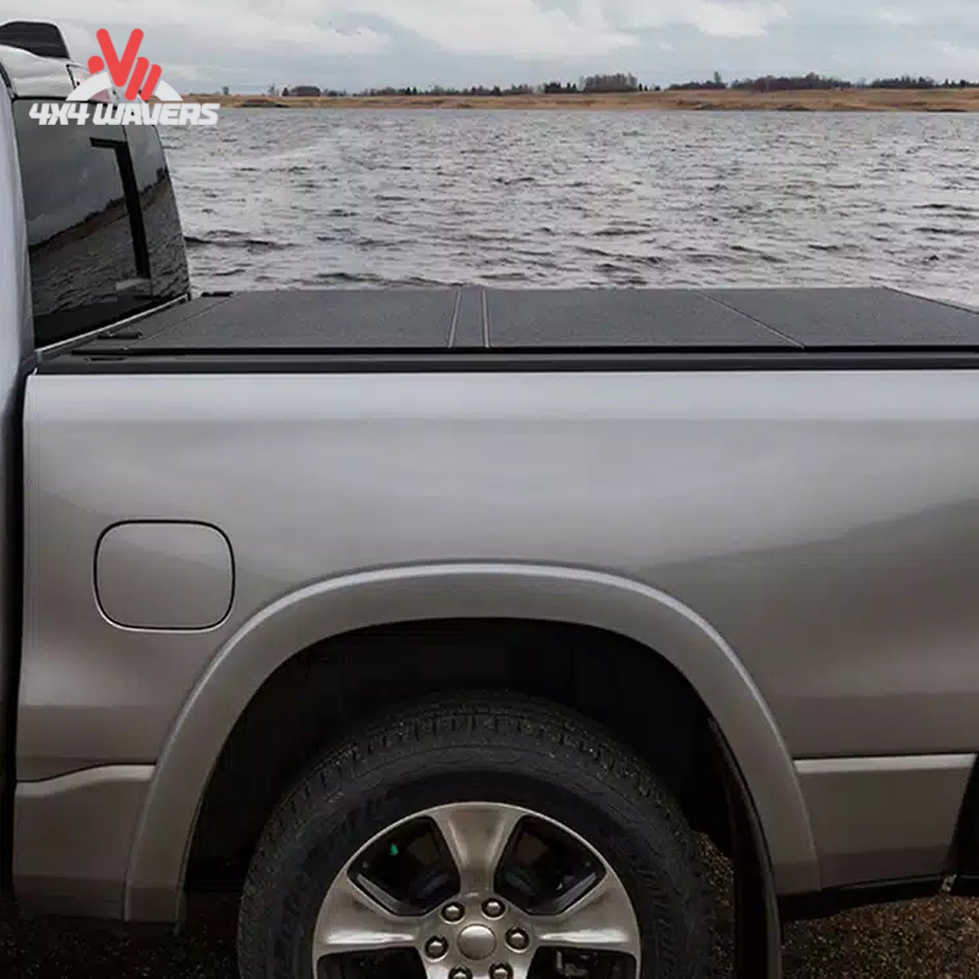 A close-up showing how the low profile aluminum tonneau cover seals tightly against the truck tailgate line.