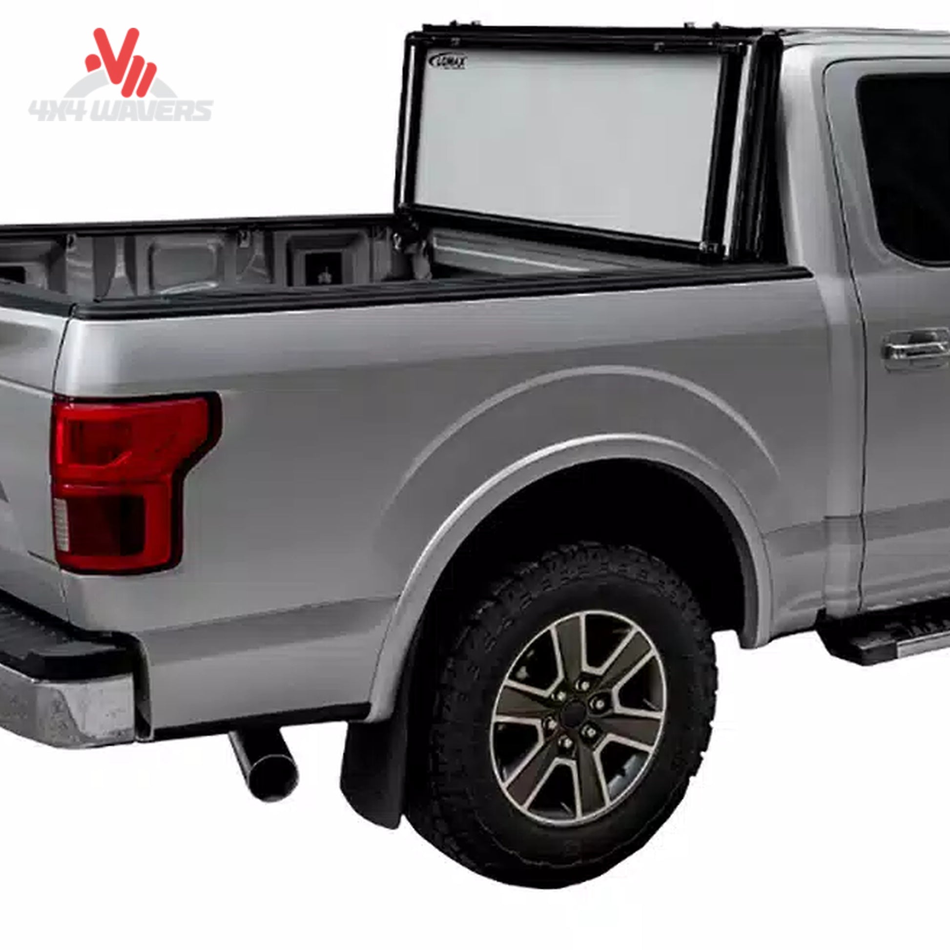 The hard folding tonneau cover locked securely in an upright vertical position away from the rear window glass.
