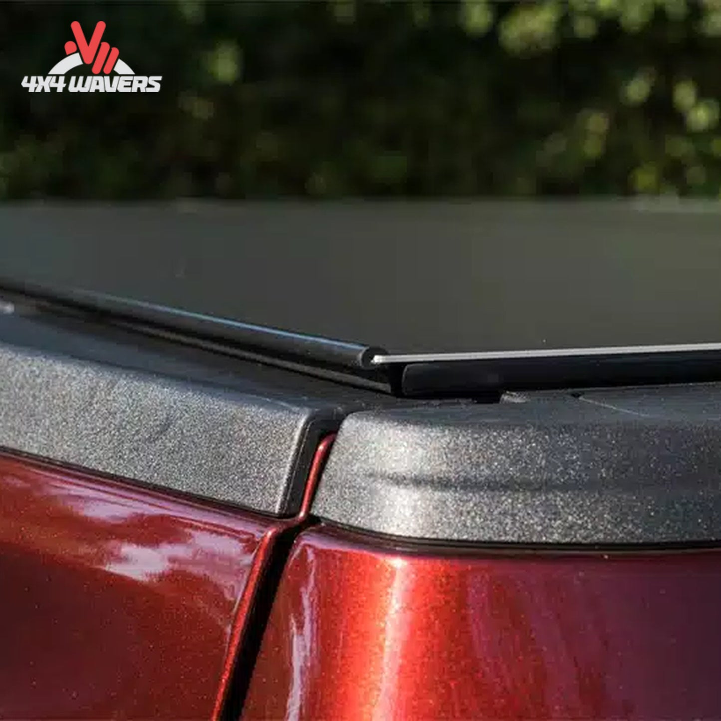 A close-up showing how the low profile aluminum tonneau cover seals tightly against the truck tailgate line.