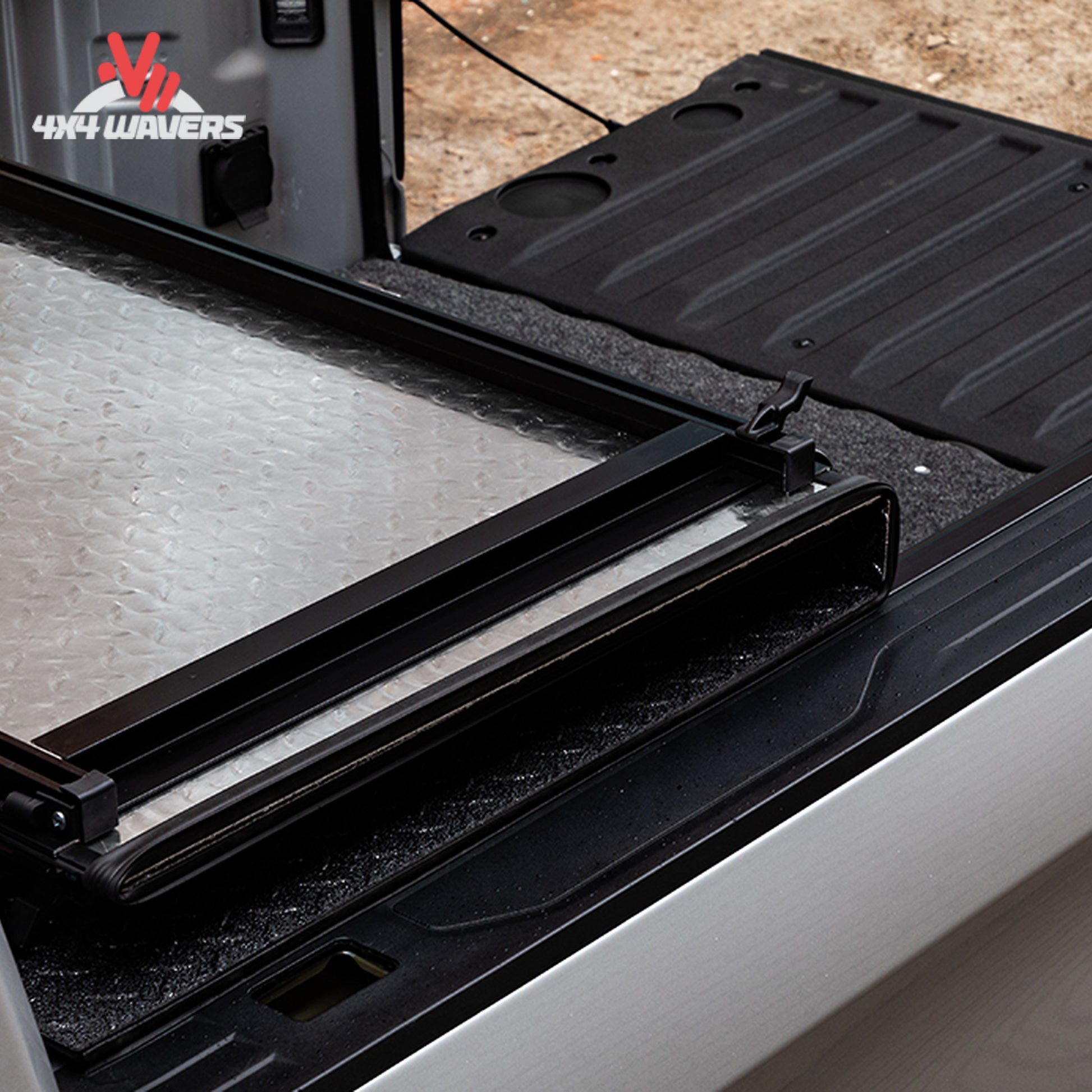 A close-up showing how the low profile aluminum tonneau cover seals tightly against the truck tailgate line.