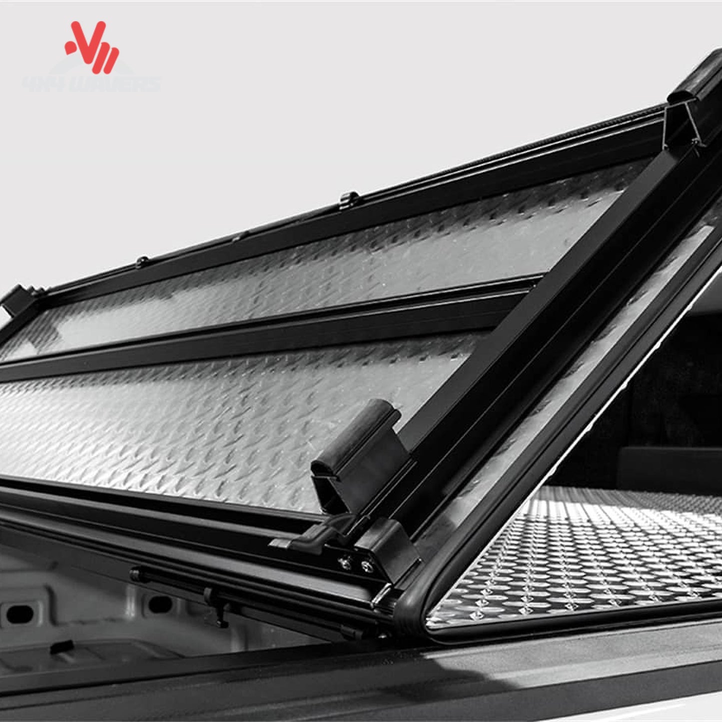 LOMAX tri-fold aluminum truck bed cover folded for full cargo access