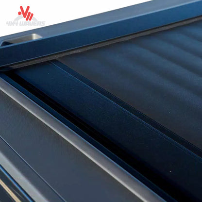 Pace Edwards Switchblade hard retractable tonneau cover with latch handle and pull strap on a 97-14 Ford F-150 6.5-foot bed