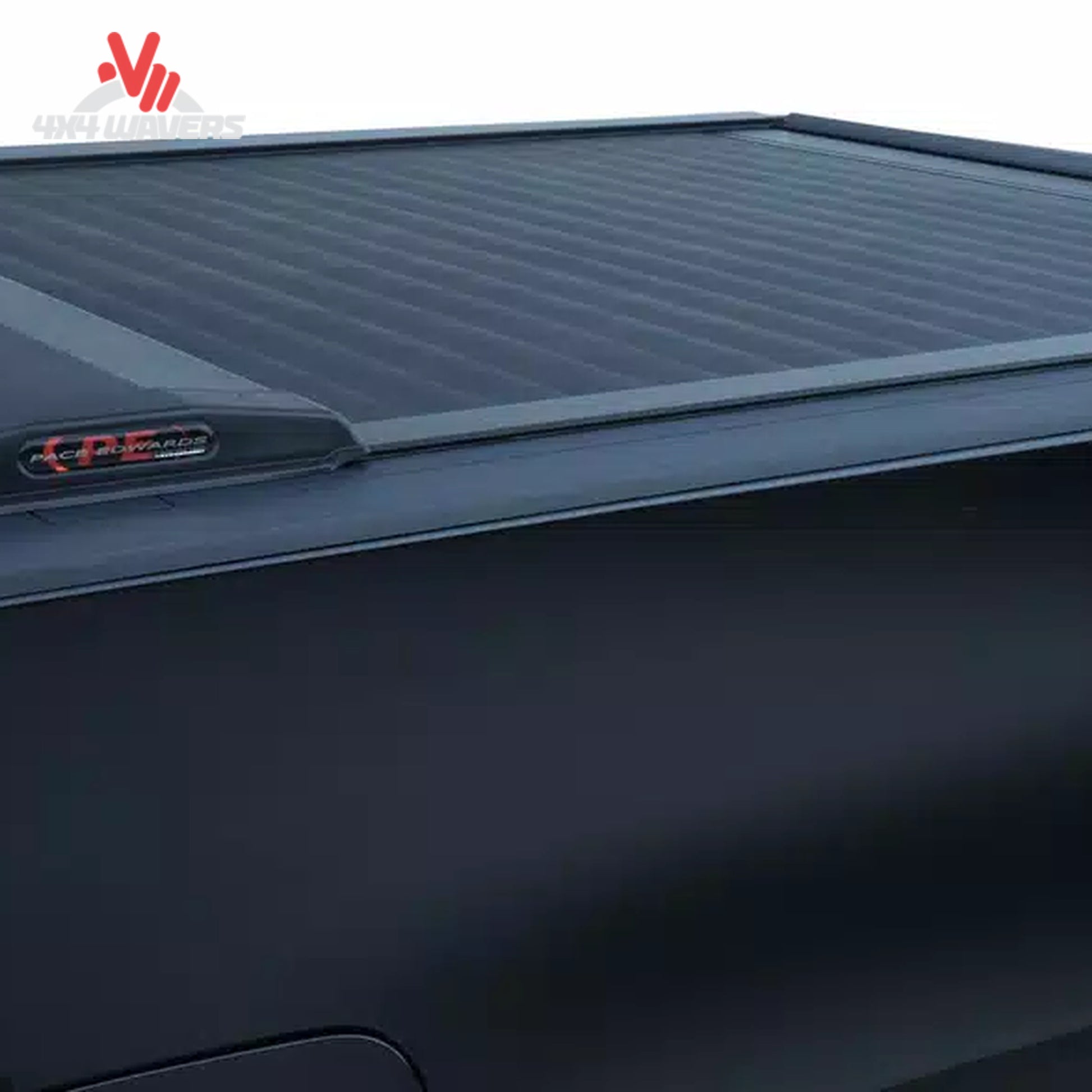 Close-up of Pace Edwards Switchblade hard retractable tonneau cover canister on a 97-14 Ford F-150 with a 6.5-foot bed.