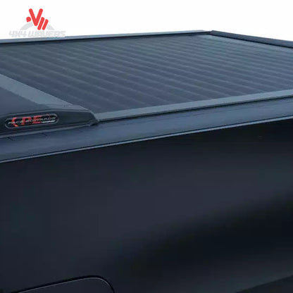 Close-up of Pace Edwards Switchblade hard retractable tonneau cover canister on a 97-14 Ford F-150 with a 6.5-foot bed.