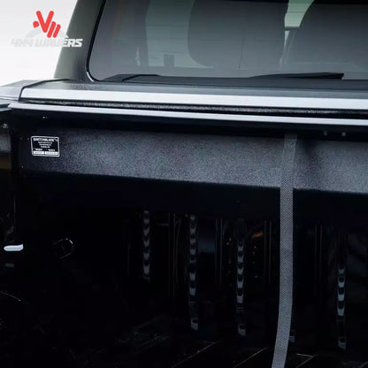 Close-up of Pace Edwards Switchblade retractable tonneau cover canister on a 97-14 Ford F-150 with 6.5-foot bed.