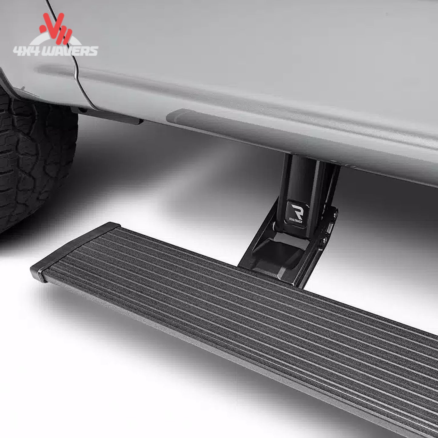 Automatic running board extended below a lifted Ford Bronco for easier vehicle entry