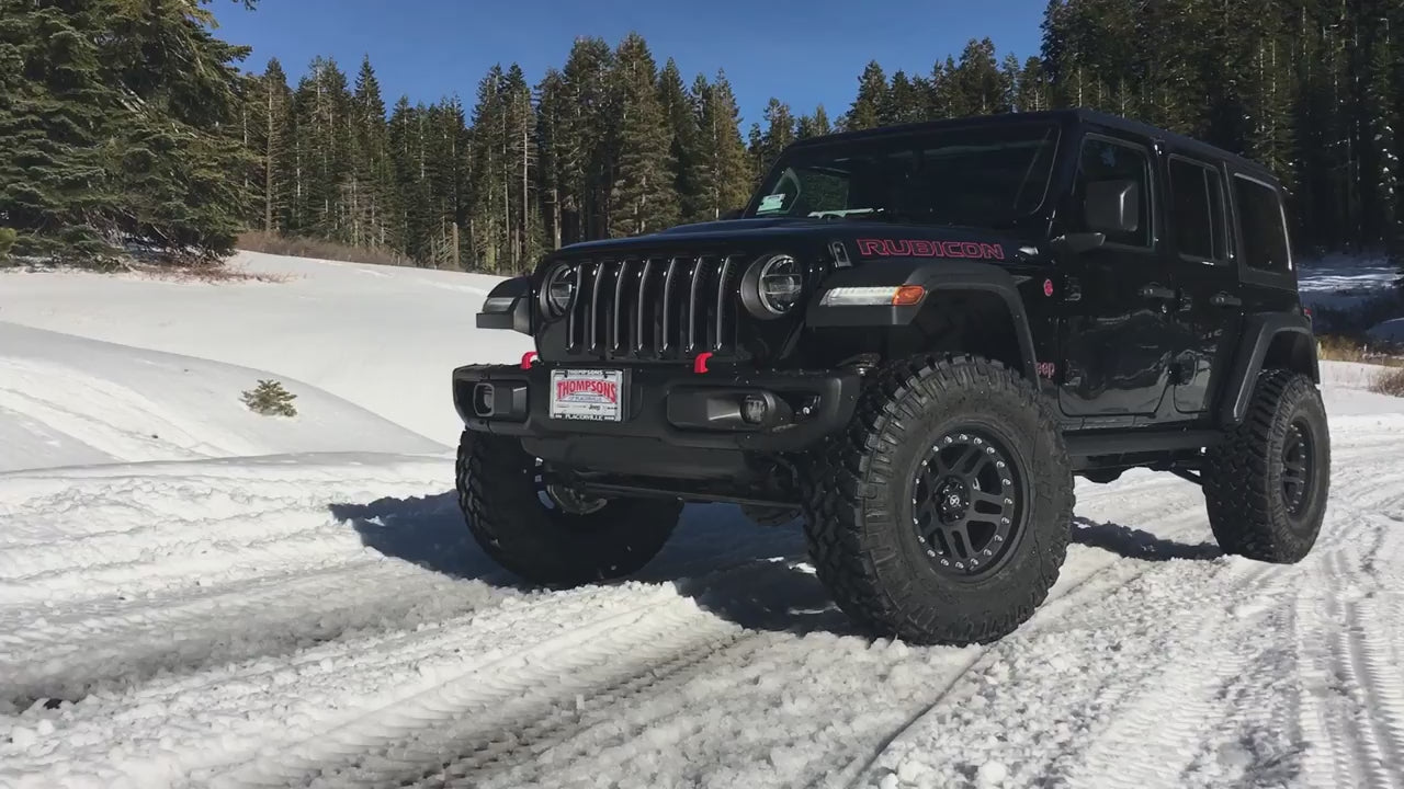 Jeep Wrangler JL Rubicon using ReadyLIFT suspension system on rocky terrain