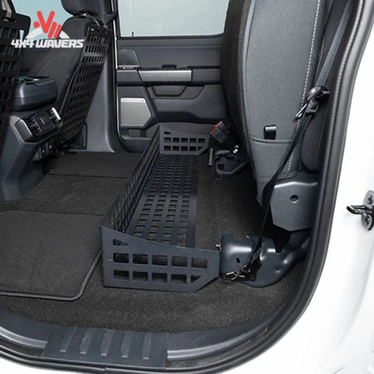 Putco MOLLE under seat storage system installed in a Ford F-150 or F-250 SuperCrew truck for organized bed storage.
