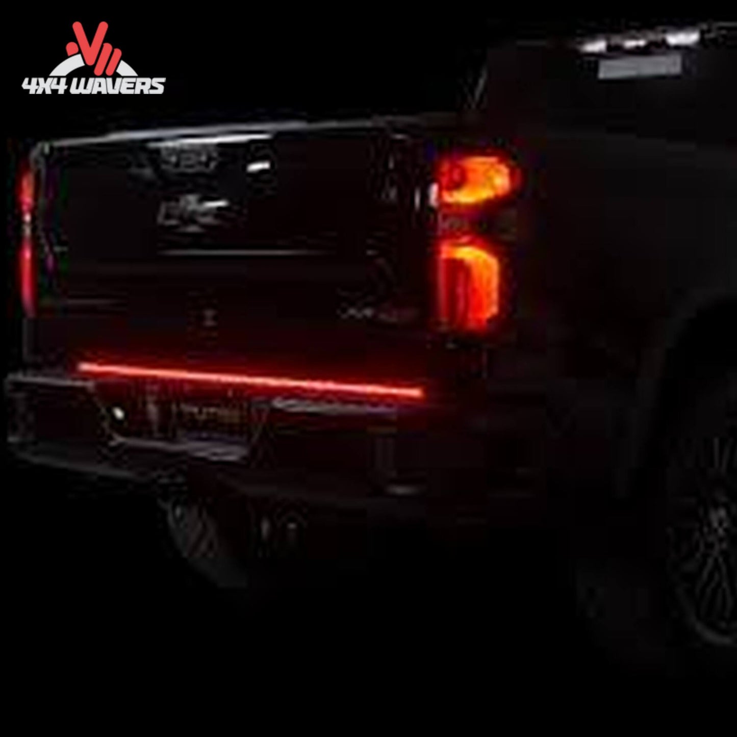 Putco Freedom Blade LED tailgate light bar illuminated on Chevrolet Silverado rear bumper gap SKU 760060-05