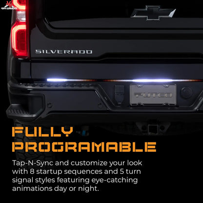 Putco Freedom Blade LED tailgate light bar with sequential turn signals on a 2005-2026 Toyota Tacoma or Gladiator pickup truck.