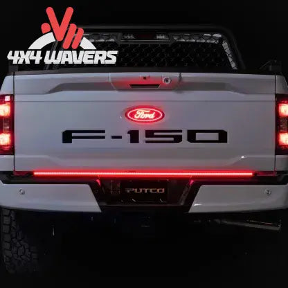 Putco Freedom Blade LED tailgate light bar with sequential turn signals on a 2005-2026 Tacoma and Gladiator pickup truck.