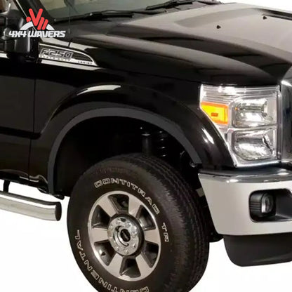 Stainless steel Putco Fender Trim Kit installed on a 2015-2017 Ford F150, enhancing wheel well appearance with sleek fender flares.