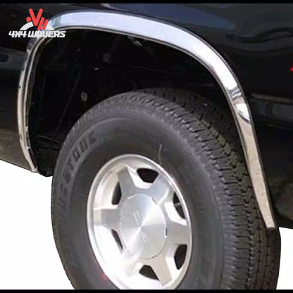 Putco stainless steel fender trim kit for 2021-2026 Ford F150, showing close-up of rubber gasket detail on fender flares.