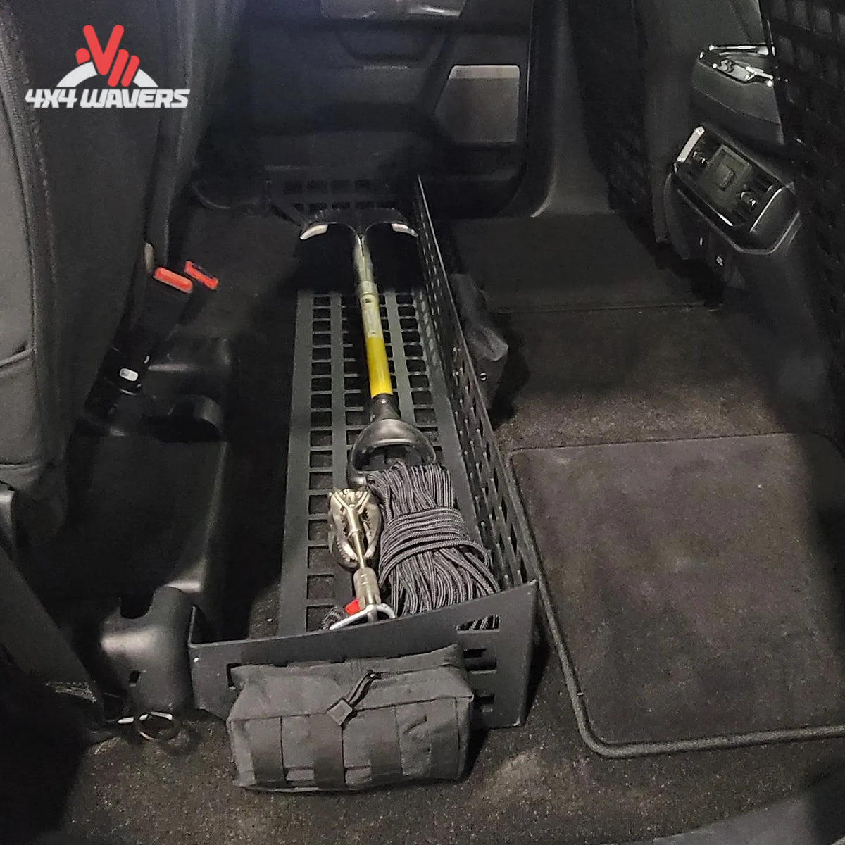 Putco MOLLE Under Seat Storage System with loaded gear bags and clamps installed in a Ford F-150 or F-250/F-350 SuperCrew cab.