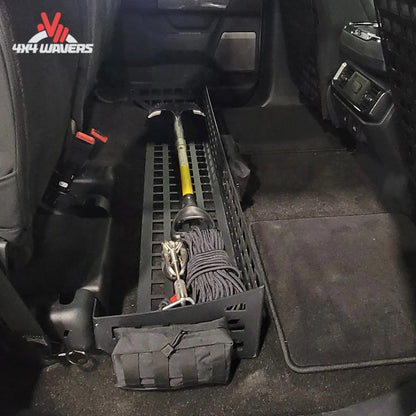 Putco MOLLE Under Seat Storage System with loaded gear bags and clamps installed in a Ford F-150 or F-250/F-350 SuperCrew cab.