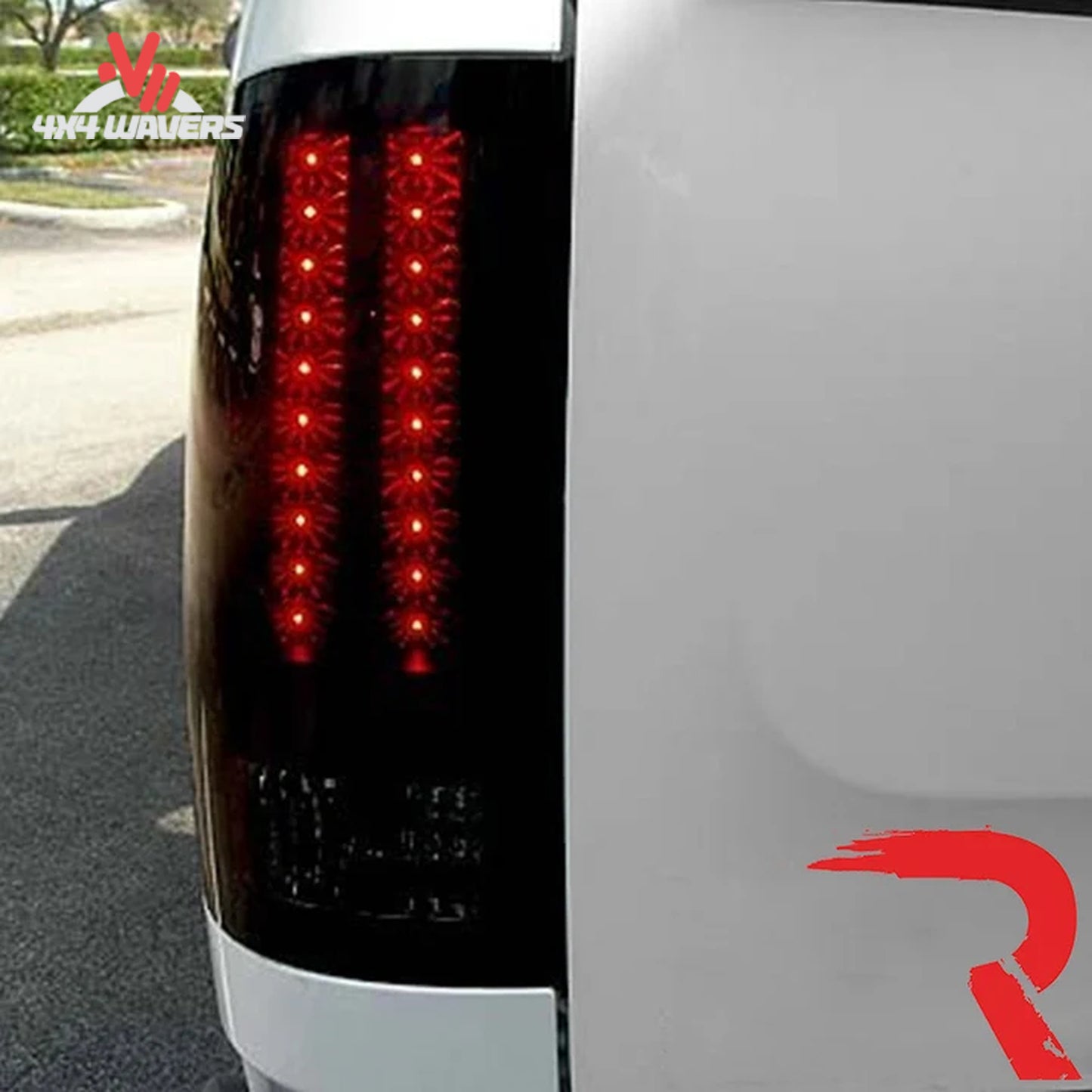 Recon smoked LED tail lights illuminated, designed for 2007-2013 Silverado and 2007-2014 HD trucks, featuring a sleek smoked finish.