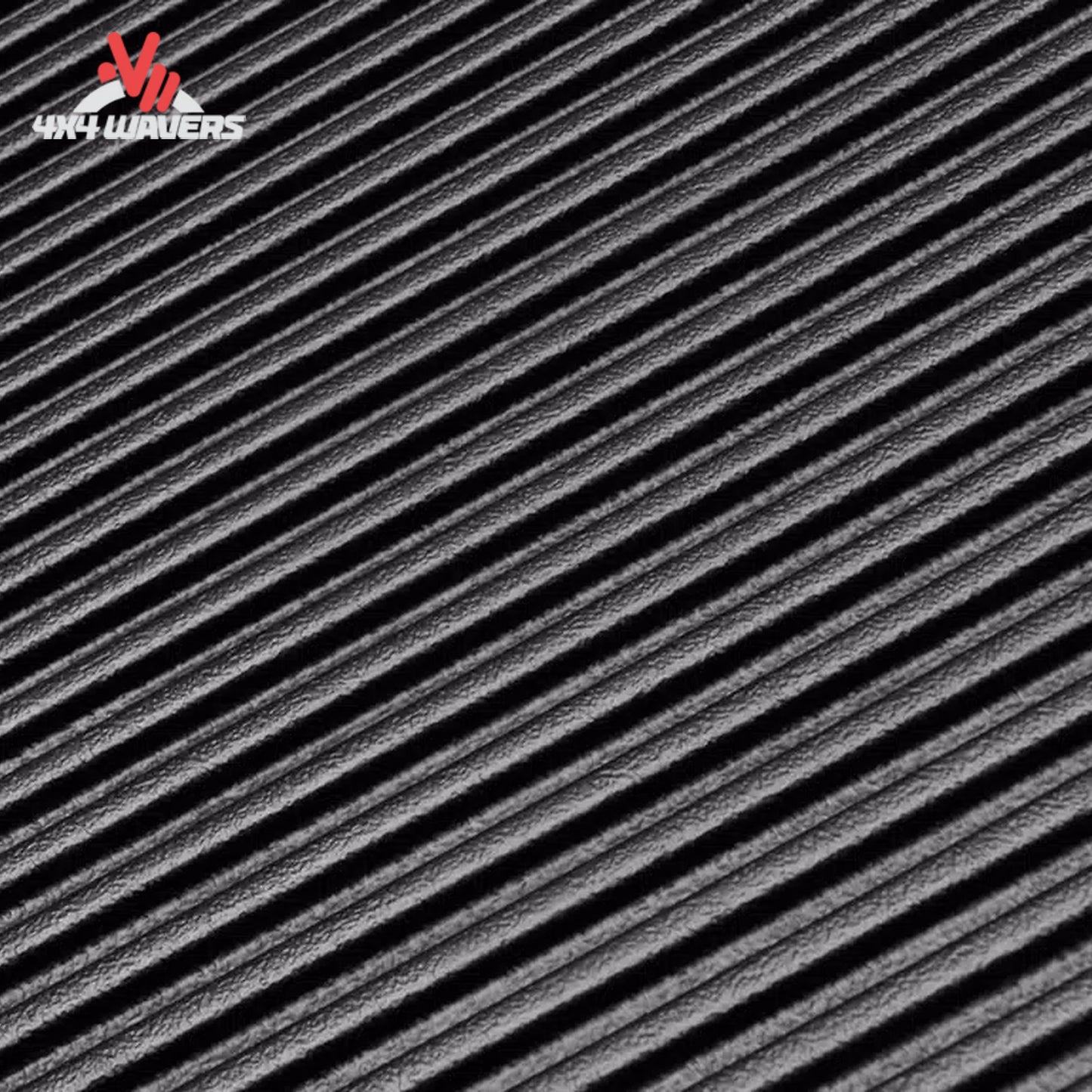 Rugged Liner bedliner for Ford F-150 8-foot bed showing textured non-pooling floor ribs in black rubber material