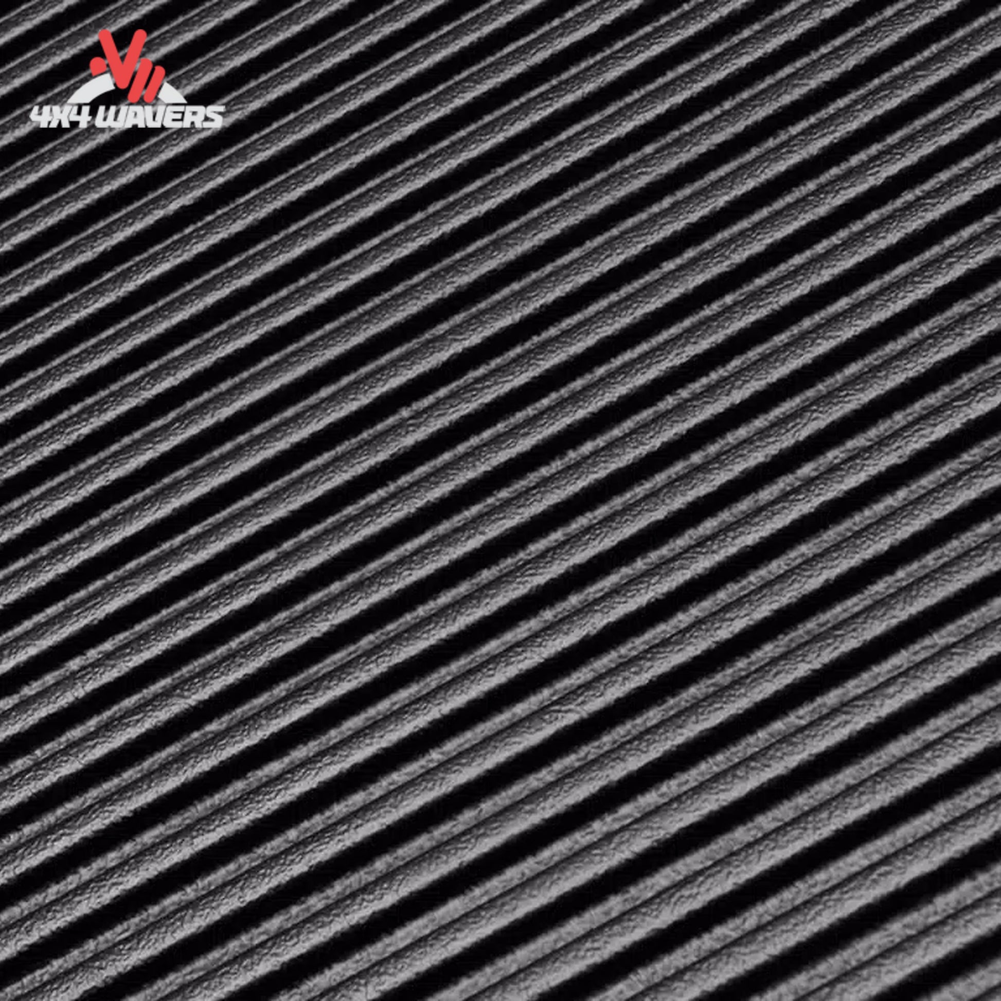 Rugged Liner bedliner for Ford F-150 8-foot bed showing textured non-pooling floor ribs in black rubber material