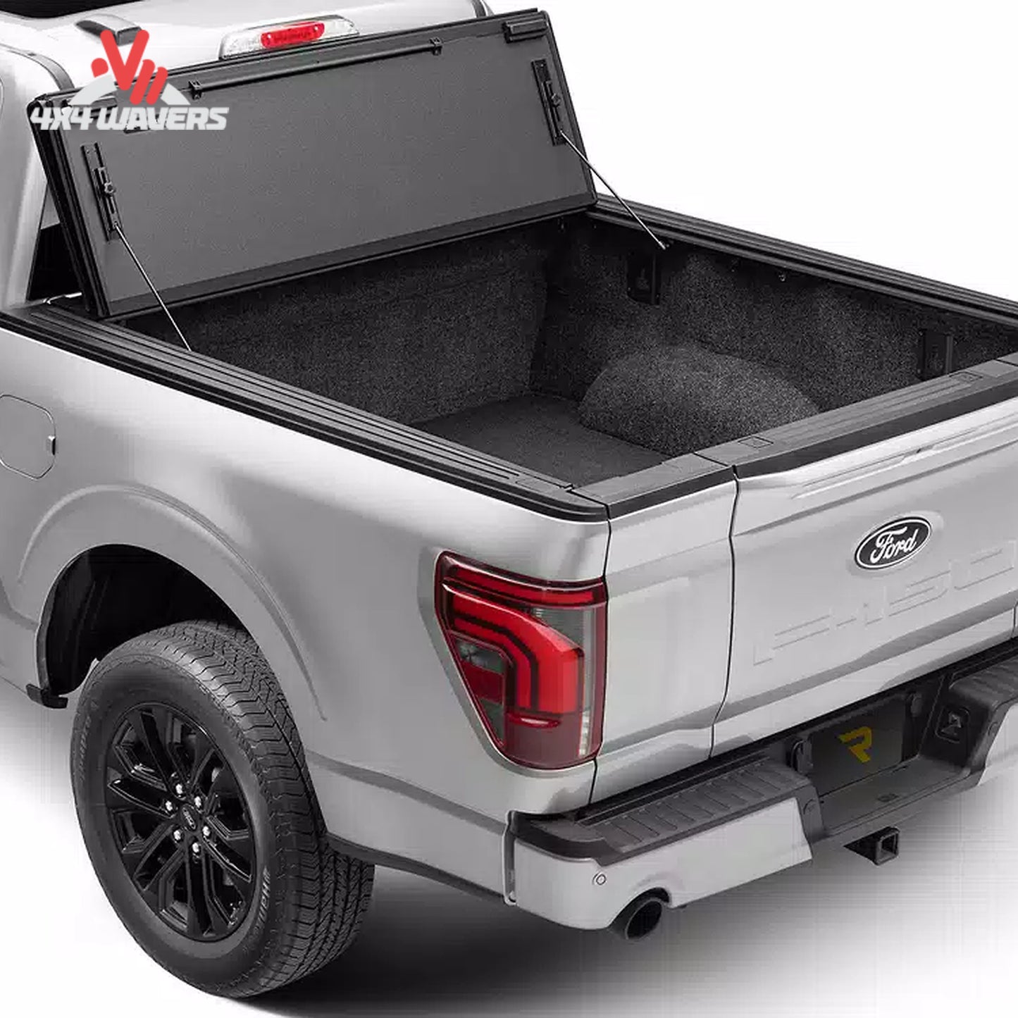 Cubierta rígida plegable BAKFlip MX4 negra para una Jeep Gladiator JT 2020-2026, mostrada parcialmente plegada sobre la caja de la camioneta.