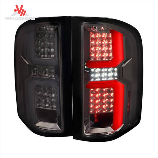 Spec-D Tuning smoked LED tail lights for 2014-2018 Silverado and 2015-2019 HD trucks, showing sleek smoked lens design.