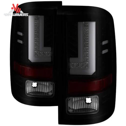Spyder Auto smoked LED tail lights installed on a 2016-2019 GMC Sierra, showcasing sleek, smoked lens design for enhanced vehicle style.