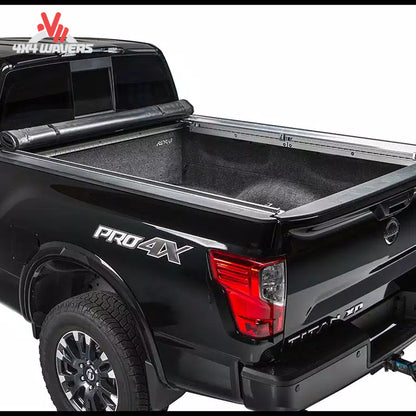 A 5.5 foot soft vinyl tonneau cover completely rolled up behind the truck cab showing open bed access SKU BGPC_22010369.